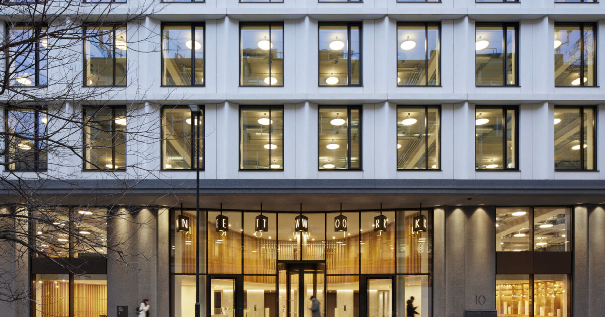 Network at 21 Brock Street, Camden. Evening view of the building's entrance with illuminated windows.